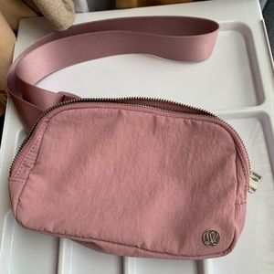 Pink Lululemon everywhere belt bag. Got as a gift, never worn or used.